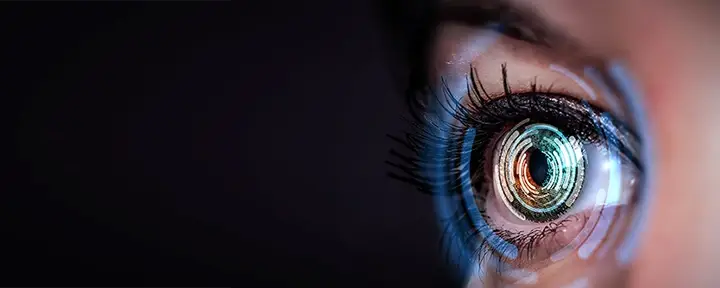 Human eye getting scanned by high-tech machinery.