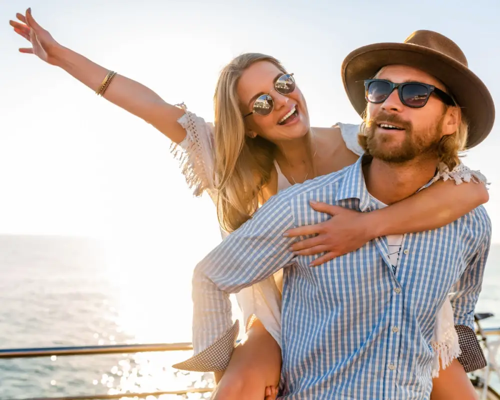 Young man and woman near beach with modern eyewear.