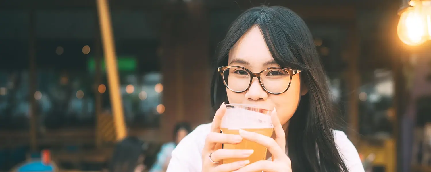 Stylish young woman wearing eyeglasses.