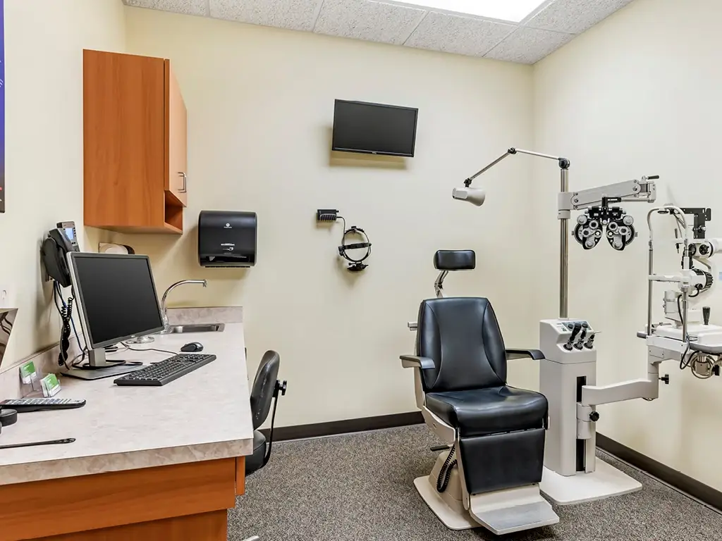 Exam room with medical eye exam equipment.