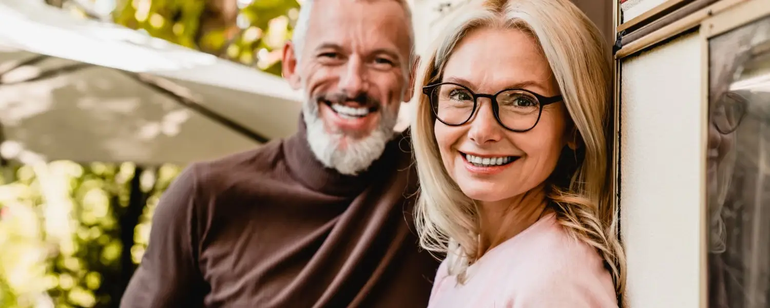 Adult woman and man wearing eyeglasses.