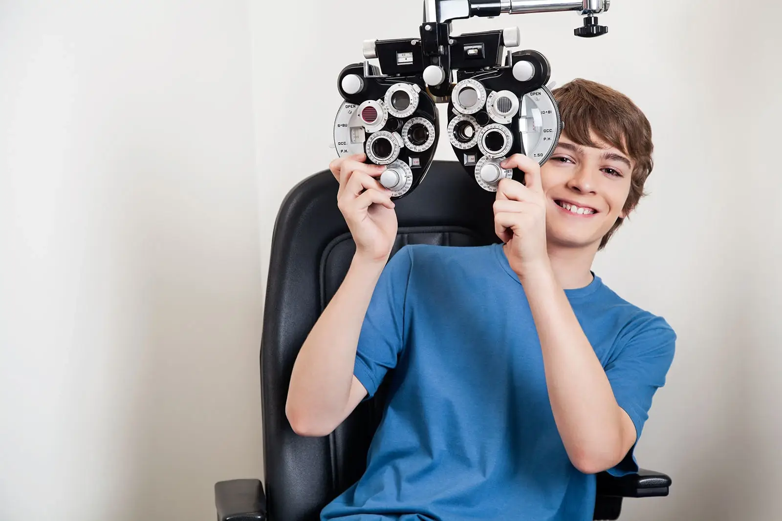 Young boy getting eye exam.