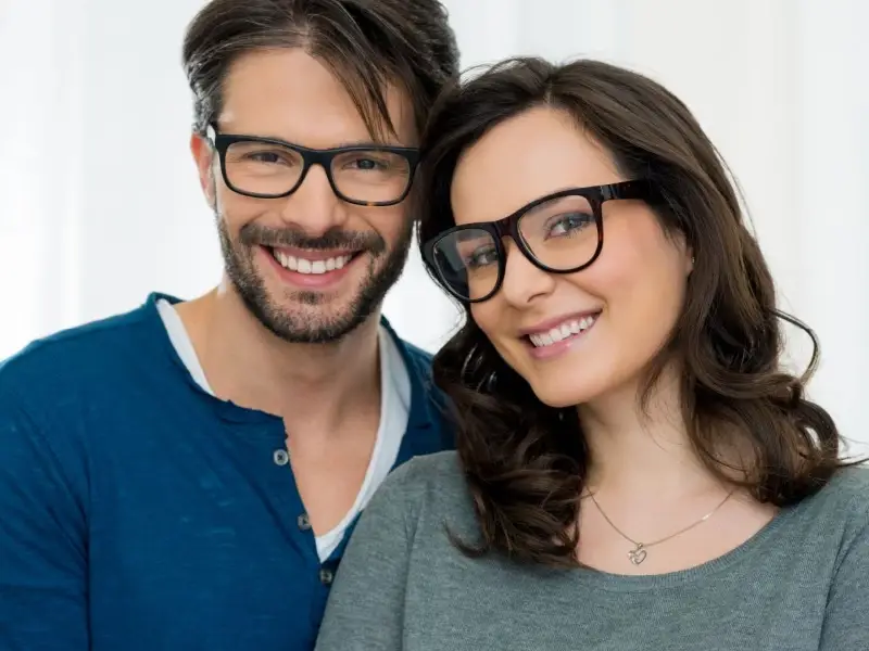 Couple wearing designer eye frames.