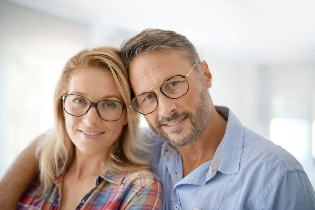 Couple wearing eyeglasses.