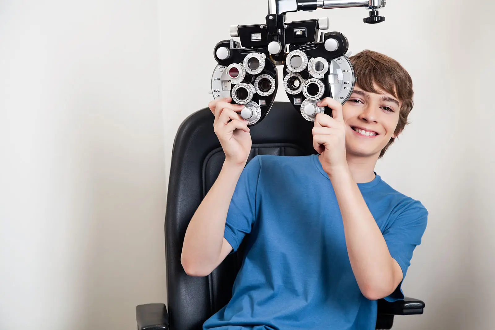 Young boy at eye doctor office.