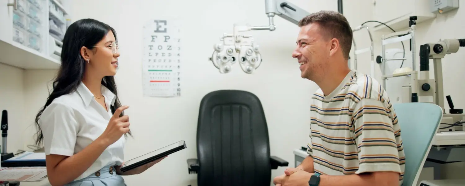 Young man with eye doctor during eye exam