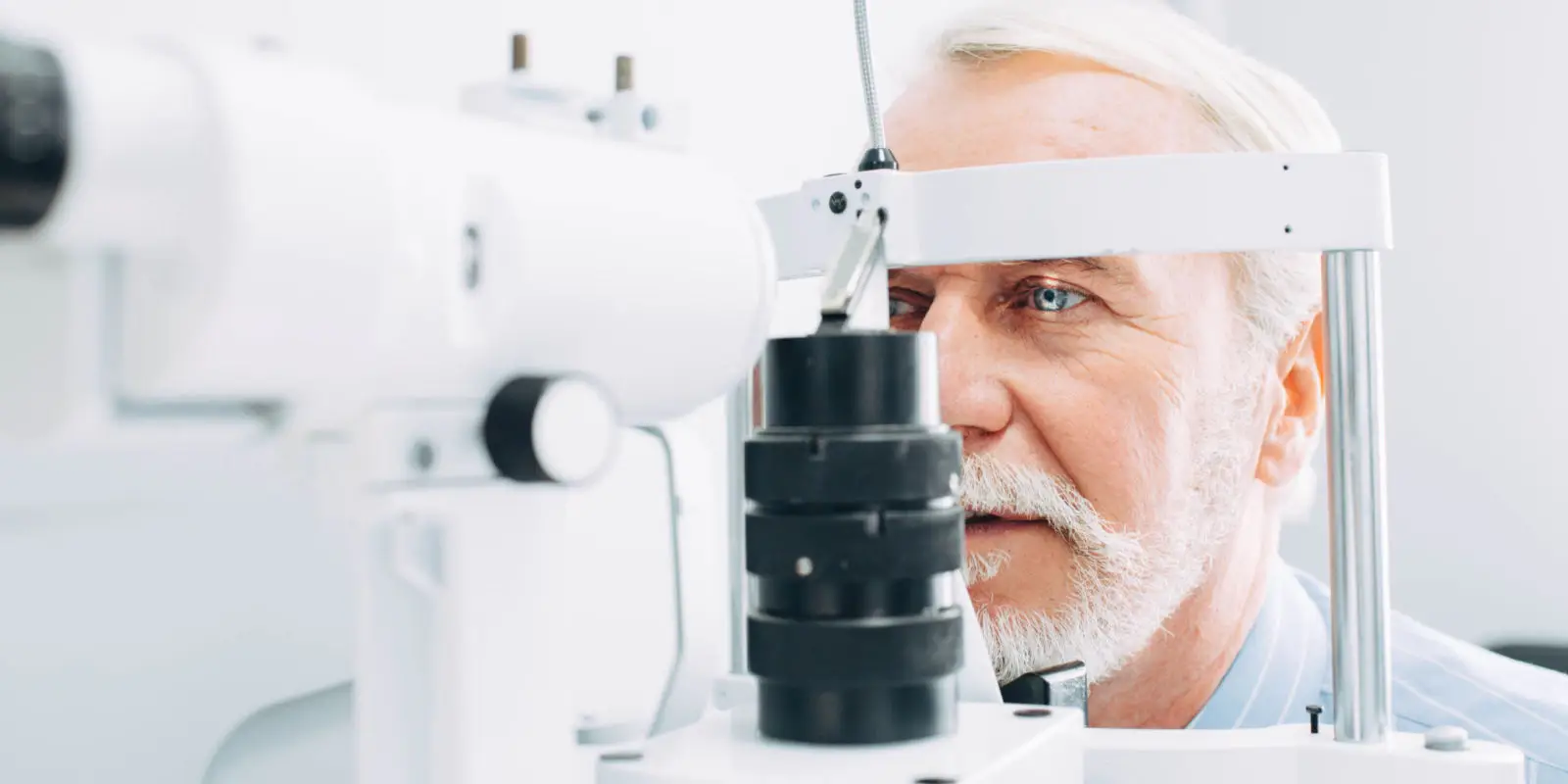 Adult male getting an eye exam.