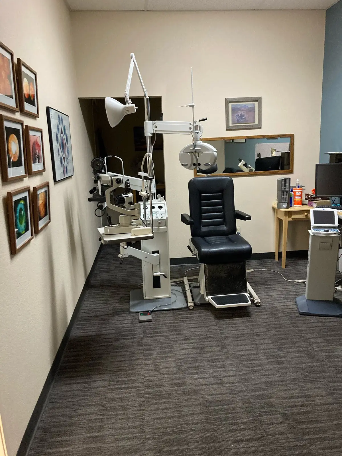 Exam room with medical equipment at Alvernon Optical Campbell