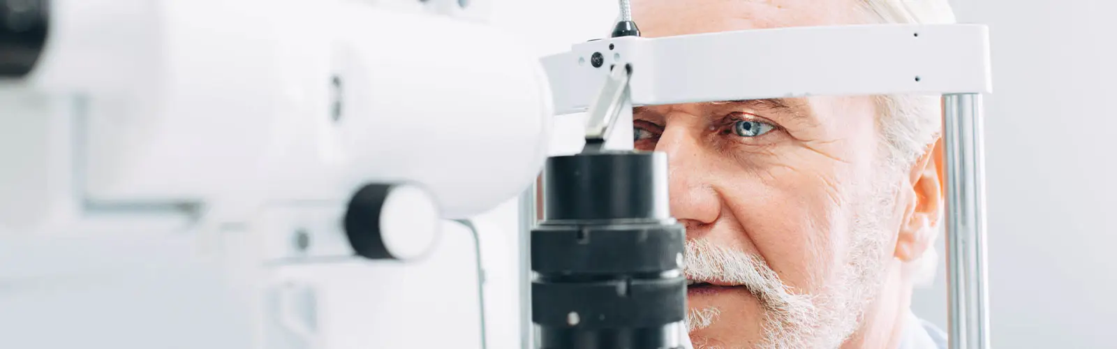 Adult Male getting eye exam.