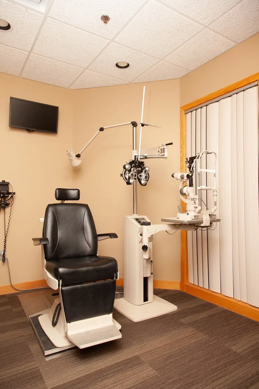Exam room with medical equipment and exam chair Eyecare Specialties O Street.