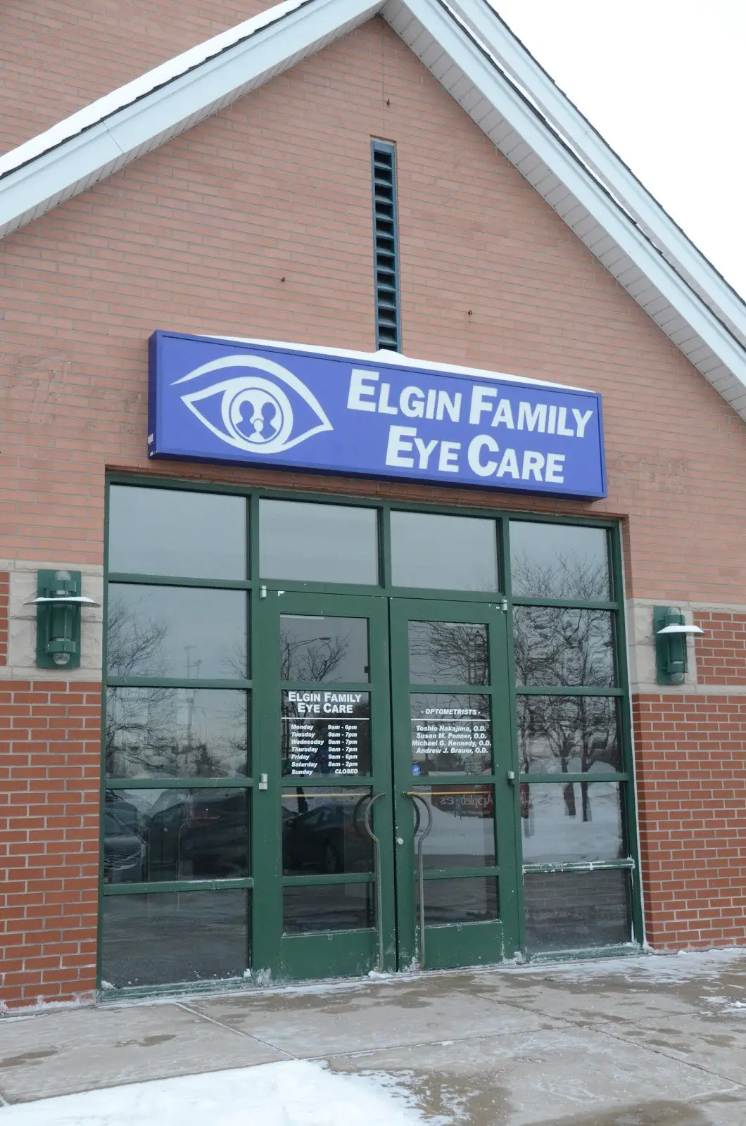 Exterior view of Elgin Family Eyecare entrance with signage.