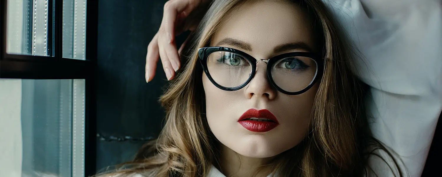 Stylish woman with bold high-end black frames.