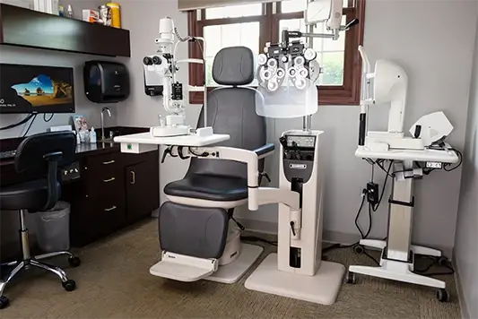 Exam room with medical equipment at Forzley Eye Clinic