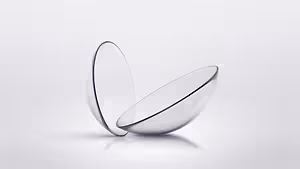 Image of two clear glass lenses on a white background