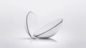 Image of two clear glass lenses on a white background