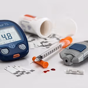 Blood sugar testing equipment and supplies on a white surface