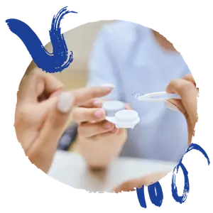 Image of two hands with one holding a contact lens and the other holding a pair of tweezers.