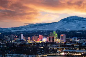 Reno Nevada skyline at dusk with mountains in the background