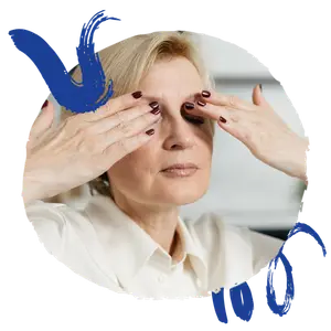 Woman wearing white shirt touching eyes with hands