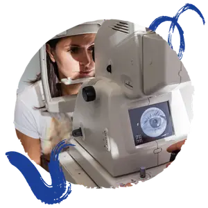 Woman wearing a white shirt and a white headband looking into an optical device with an image of an eye on the screen.