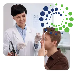 Optometrist applying drops to patient's eye