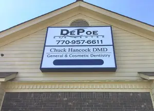 Sign outside of DePoe Eye Center and Chuck Hancock DMD