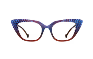 A pair of eyeglasses with a blue and red frame and a diamond pattern on the sides