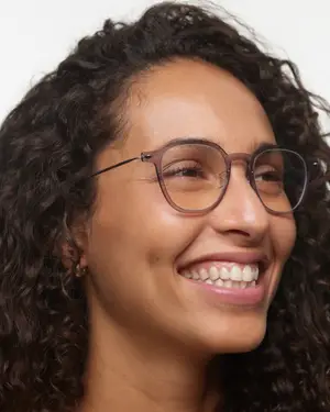 woman with glasses smiling