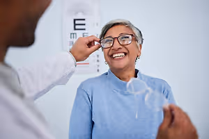 Woman trying on glasses