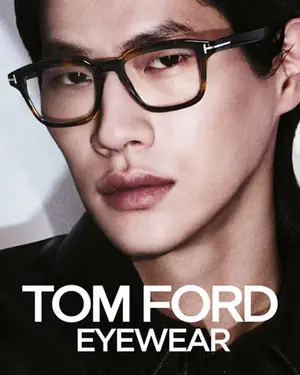 A man wearing Tom Ford Eyewear glasses with a black jacket