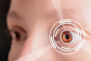 An eye with a computer chip pattern and a cross symbol in the center