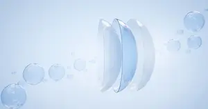 Three transparent bubbles floating in blue water