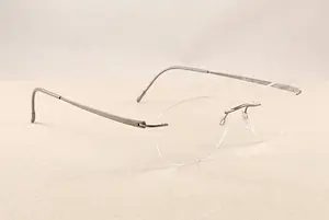 Close up of a pair of glasses on a cream background