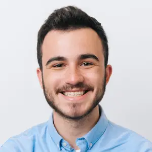 studio portrait of smiling young man