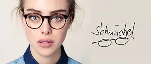 Model wearing eyeglasses with the logo for Schnichel Eyewear.