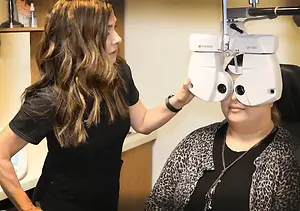 Woman having her eyes checked at the optometrist's office