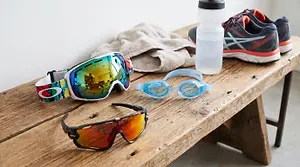 Goggles, shoes, and water bottle on a wooden bench