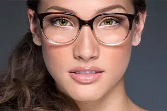 Close up of a woman wearing glasses.