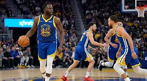 Golden State Warriors basketball player dribbling the ball in a game