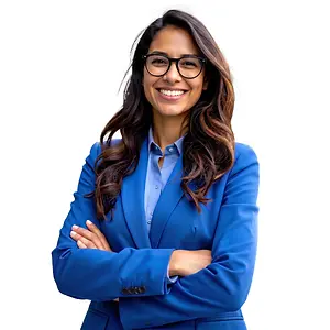 A professional woman with glasses smiling and posing for a photo