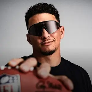 American football player with sunglasses and an NFL football