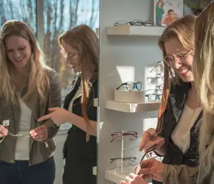 Four women smiling and looking at a pair of glasses inside an optical store.