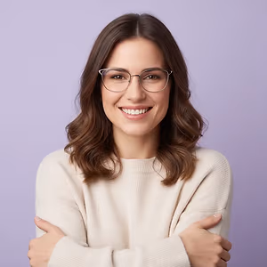 Woman wearing glasses and a white sweater smiling with arms crossed