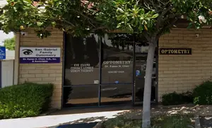 The entrance to San Gabriel Family Optometry has a sign that says 'OPTOMETRY' above the entrance.