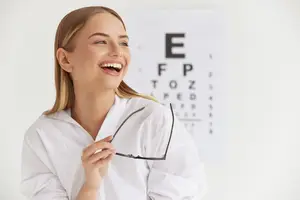 woman holding glasses