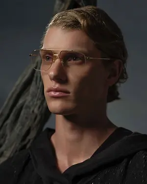 Man in black hoodie with glasses posing for a picture