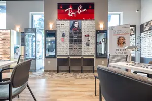 Interior of a Ray-Ban eyewear store with a display of sunglasses and a Spring Refresh promotion sign.