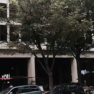 Rohi and npt restaurants with cars parked outside
