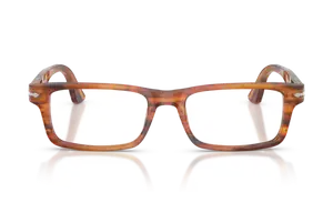 A pair of brown-framed glasses with white lenses reflecting a black background