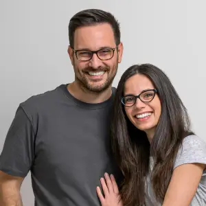 A smiling man and woman posing for a picture together